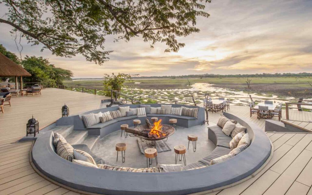 Circular seating around a fire pit, looking out across the flood plains of Luangwa River.